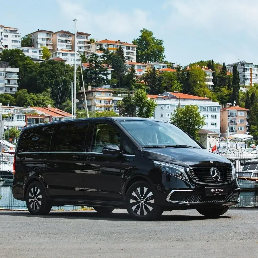 The black Mercedes V-Class parked by the water