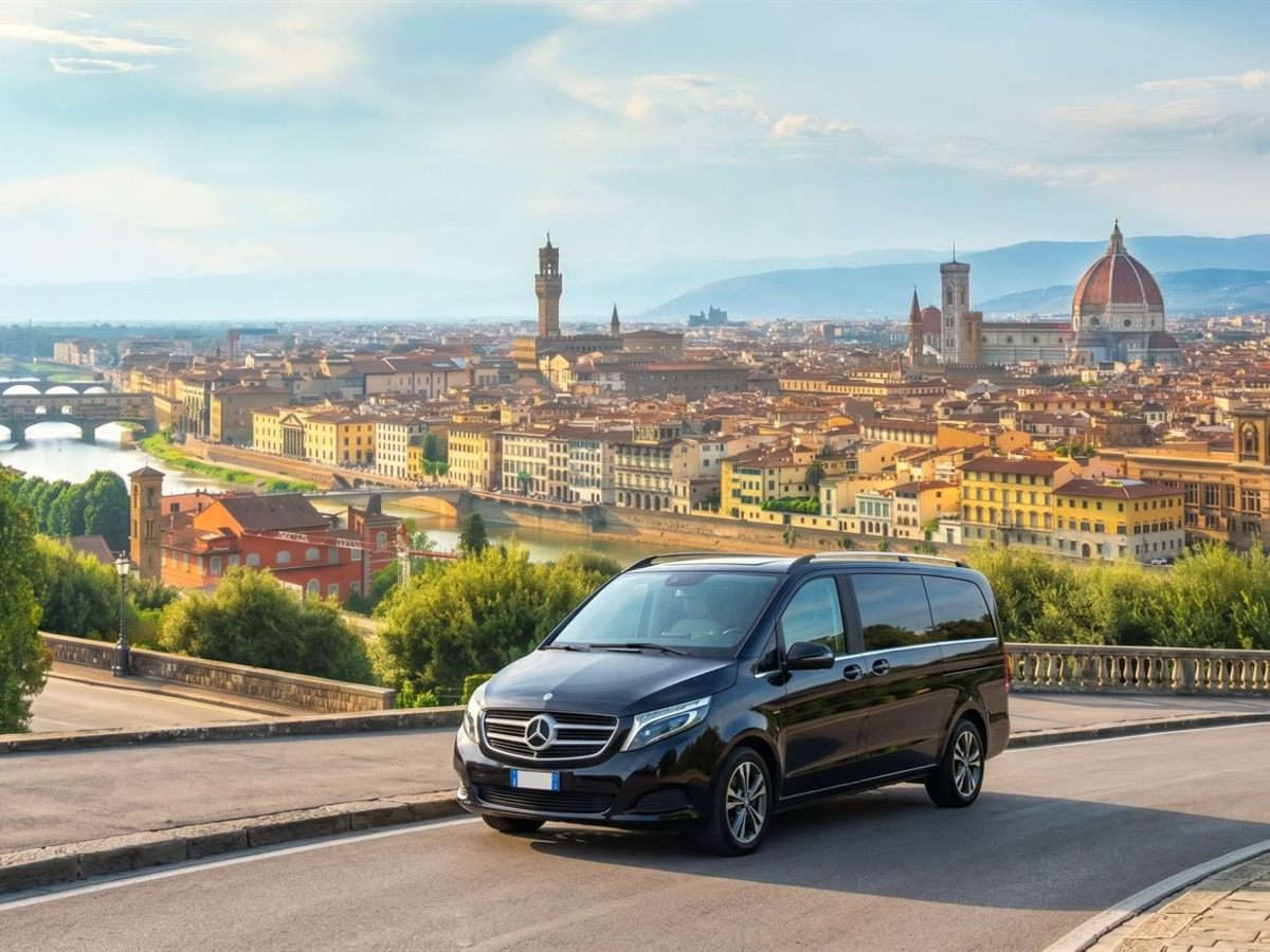 The black Mercedes V-Class on a hillside road above the Florence skyline